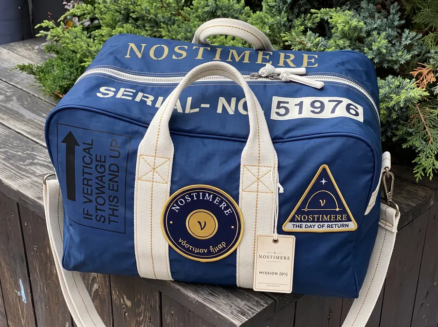 A Nostimere Blue mission duffel with Mission [01] patches