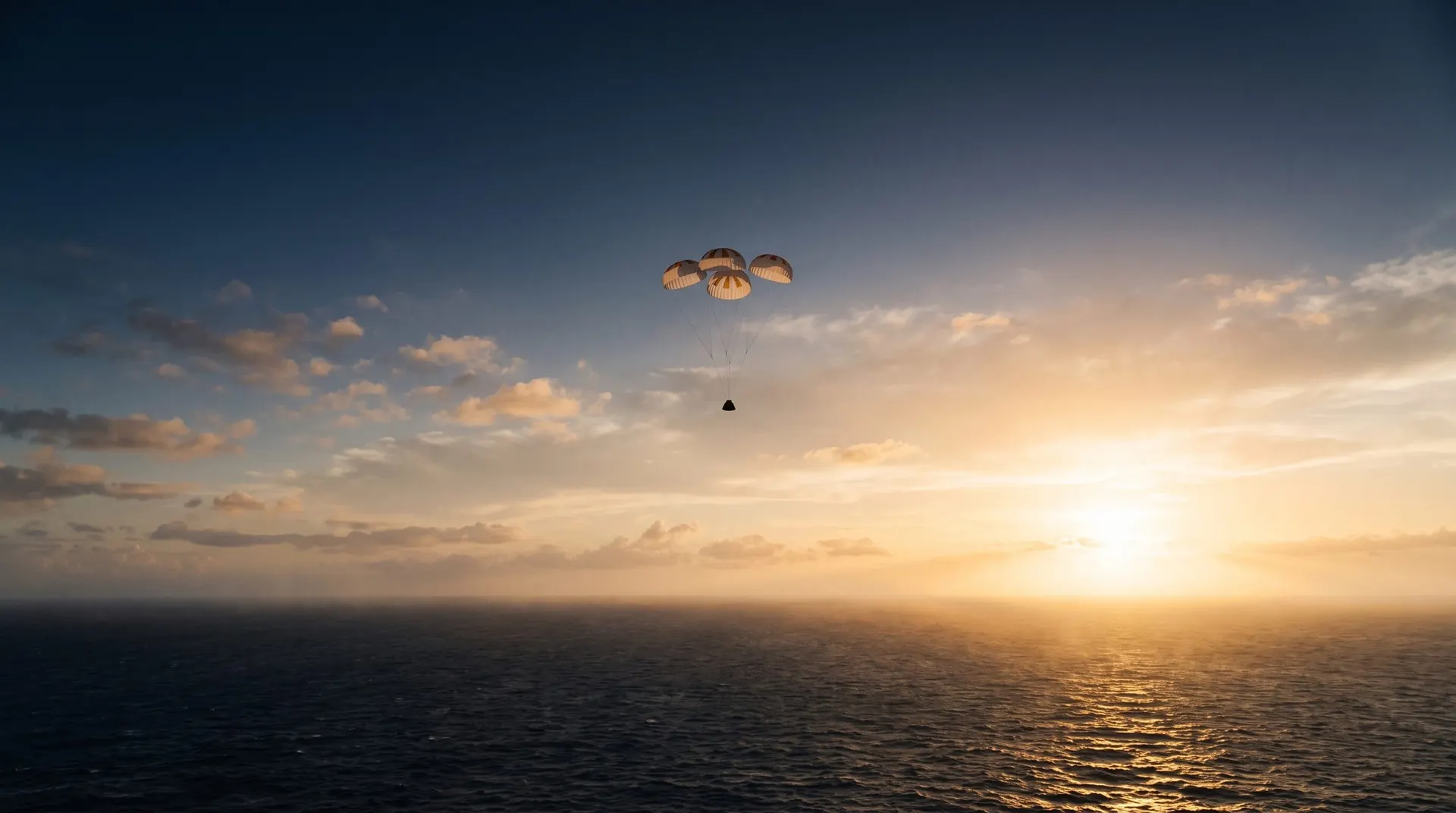 A capsule descending under four parachutes over the ocean at sunrise